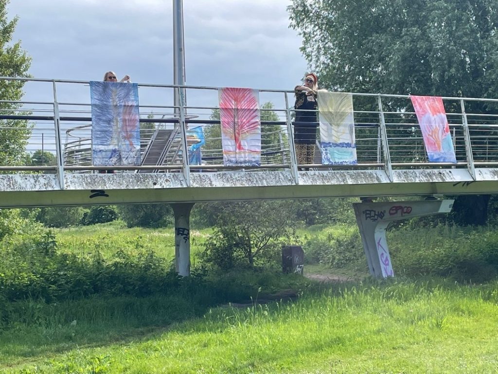 Banners on silk hanging from a bridge